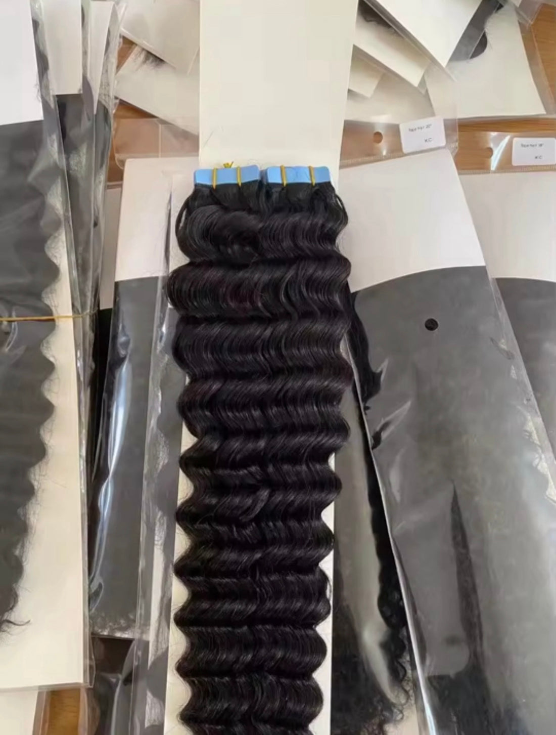 Luxury 12A tape-in hair extensions in color 1B natural black, 100% human hair, 50g per pack with 20 pieces.